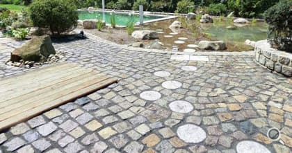 Large stone paving at the swimming pond.